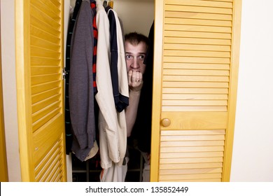 man-hiding-closet-260nw-135852449.jpg