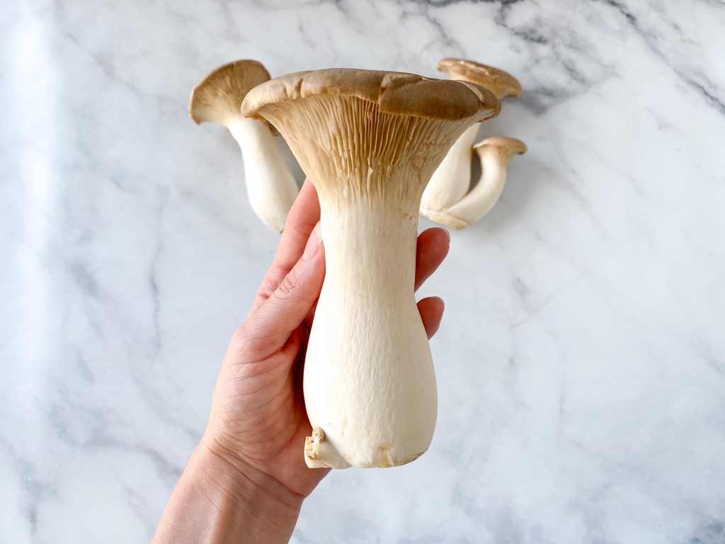 vegan-scallops-king-oyster-mushrooms-being-held-1024x768.jpg
