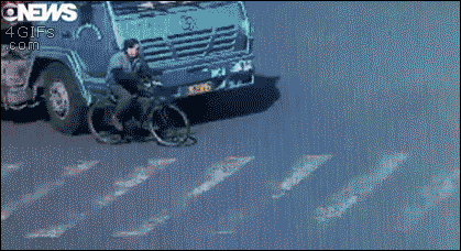Bicyclist-mack-truck-close-call.gif