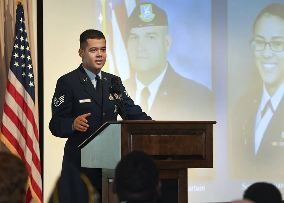 Wilmer Puello-Mota, a member of the 66th Security Forces Squadron, speaks during a gate dedication and renaming ceremony at Hanscom Air Force Base in Massachusetts, on Oct. 2, 2018. Puello-Mota, a U.S. Air Force veteran and former elected official in Massachusetts who fled the U.S. after being charged with possessing sexually explicit images of a child, told his lawyer he joined Russia’s army, and video appears to show him signing documents in a military enlistment office in Siberia, Russia. (Todd Maki/U.S. Air Force via AP)