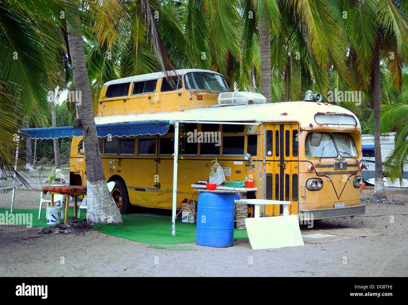 old-yellow-school-bus-converted-into-a-double-decker-camper-DG8THJ.jpg