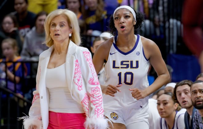 LSU head coach Kim Mulkey and forward Angel Reese watch their team against the Virginia Tech Hokies.