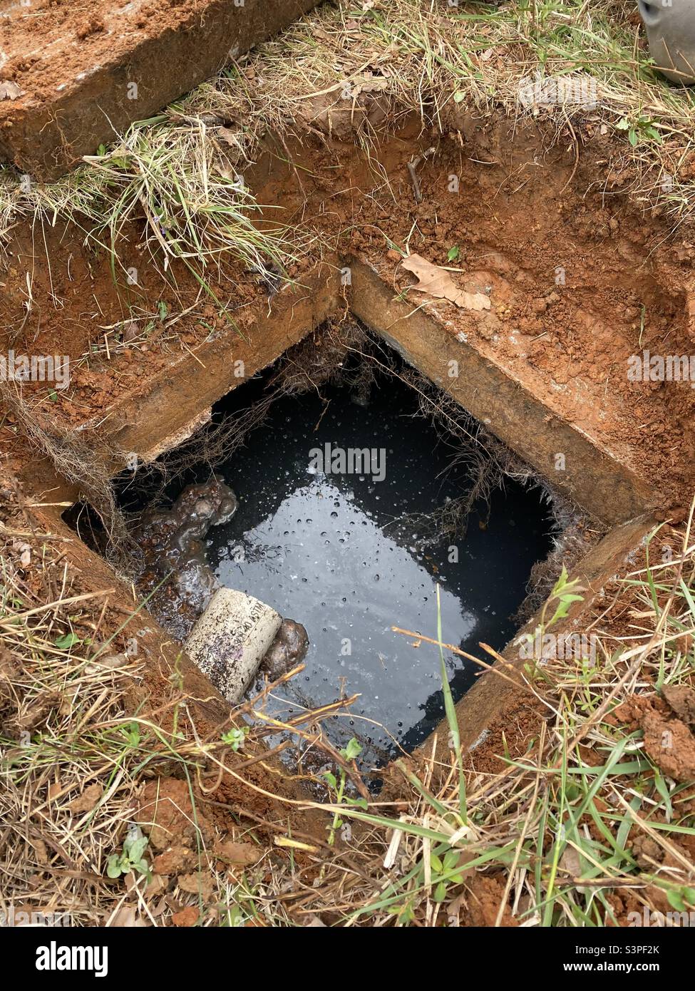 overhead-view-of-septic-tank-with-lid-off-S3PF2K.jpg