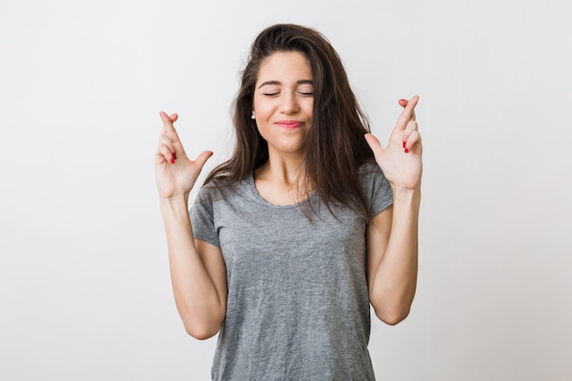 young-pretty-woman-making-wish-crossed-her-fingers-luck-closed-eyes-hopeful-gesture_285396-871.jpg