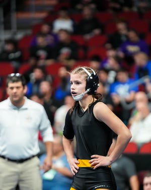 Sigourney-Keota’s Reanah Utterback, waits to wrestle Clayton Ridge’s Erik Flores at 106 pounds during the second round of the Class 1A of the Iowa high school state wrestling tournament at Wells Fargo Arena in Des Moines on Wednesday, Feb. 15, 2023.
