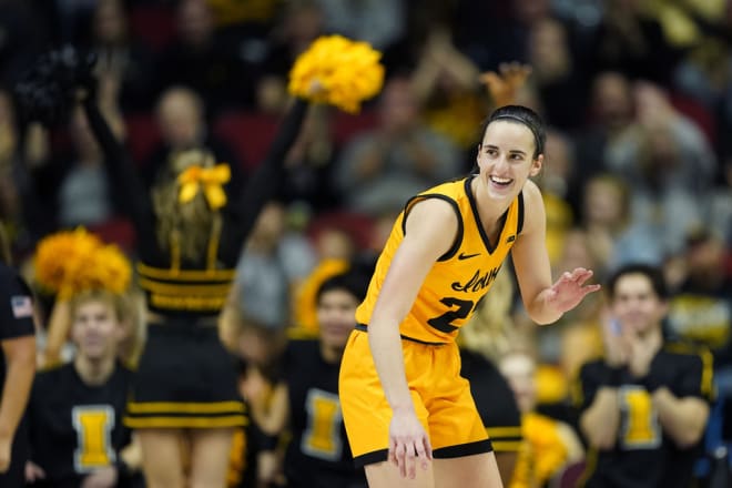 Iowa All-American guard Caitlin Clark smiles during a game against Cleveland State at the Wells Fargo Arena in Des Moines, Iowa.