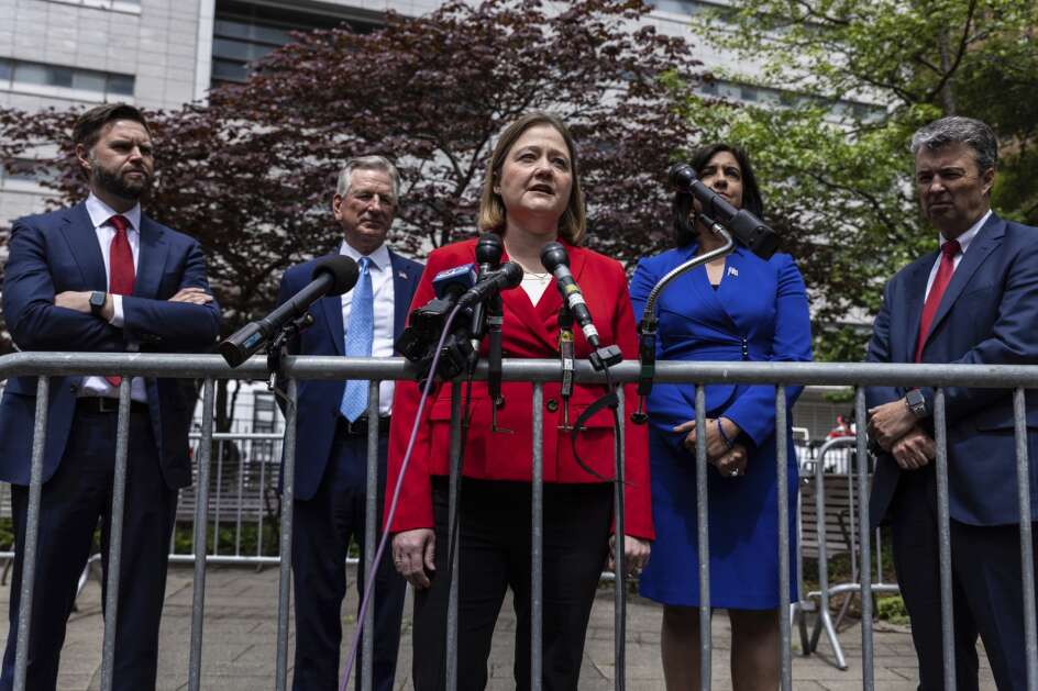 Iowa Attorney General Brenna Bird with Sen. J.D. Vance, R-Ohio, left, Sen. Tommy Tuberville, R-Ala., second left, Rep. Nicole Malliotakis, R-N.Y., right, and Alabama Attorney General Steve Marshall, speaks Monday a news conference across the street from the Manhattan criminal court in New York. (AP Photo/Stefan Jeremiah)