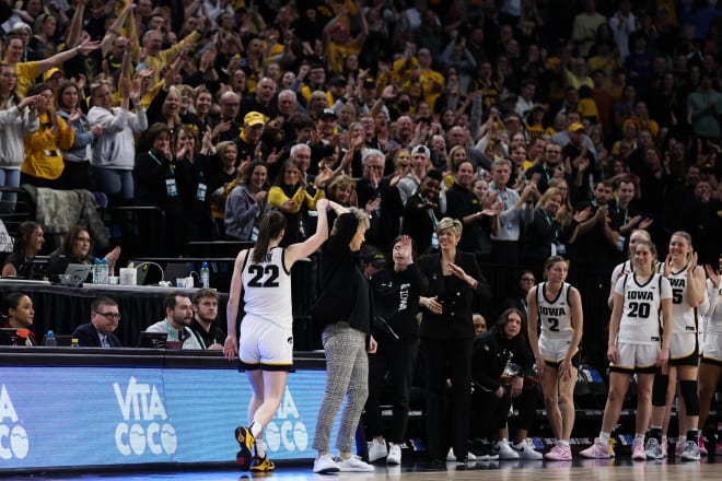 Caitlin Clark is applauded as she comes off the court against Ohio State at the Target Center.