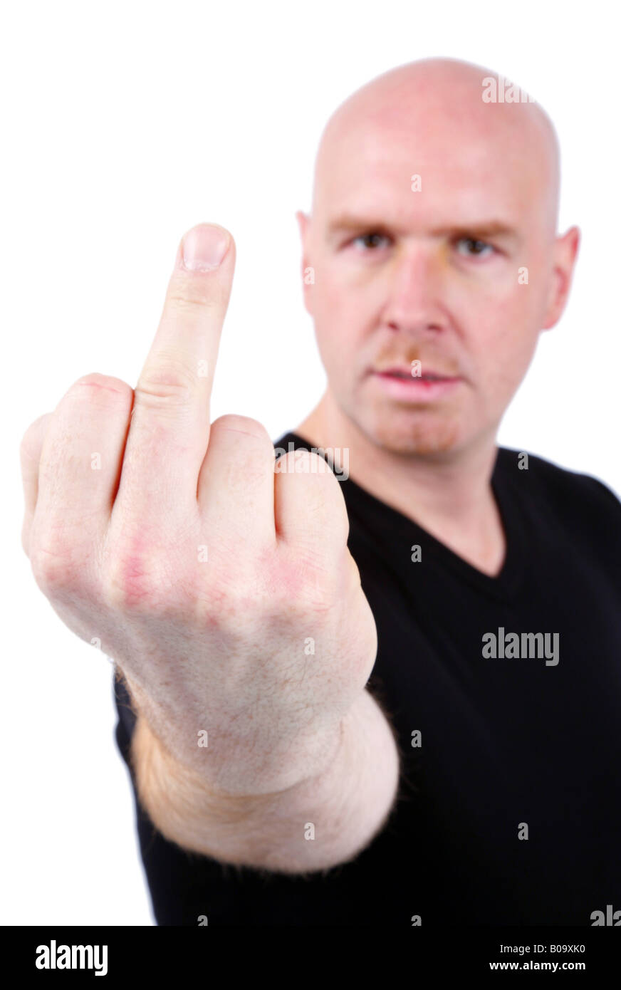 bald-headed-young-mean-man-showing-his-middle-finger-B09XK0.jpg