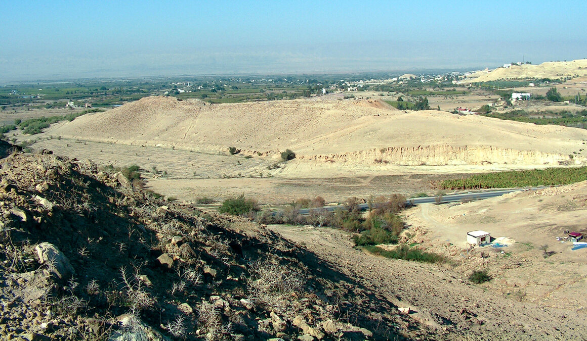 The archaeological site of Tall el-Hammam, Jordan, with the ancient city of Jericho visible on the horizon.