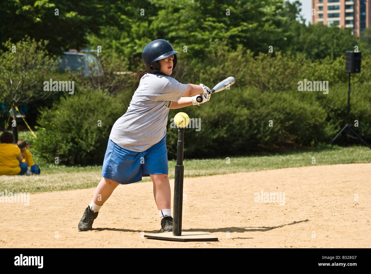 girl-at-a-special-olympics-softball-tournament-swings-and-misses-the-B328G7.jpg