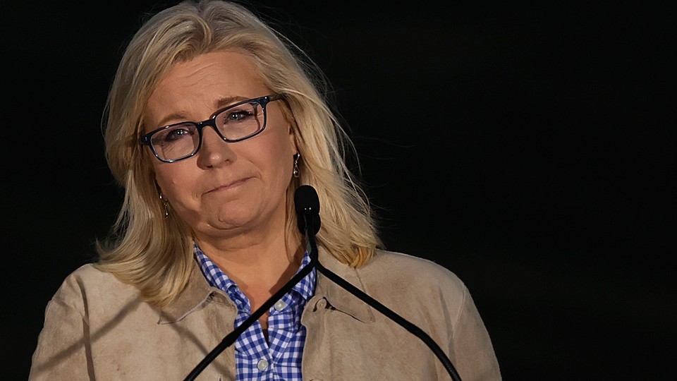 Liz Cheney in front of a microphone