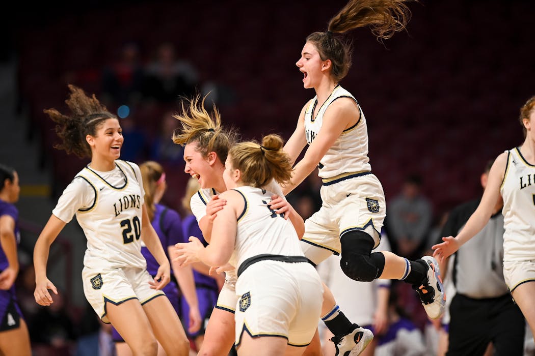 Providence Academy celebrates their 74-60 win over Albany Saturday, March 18, 2023 during the Class 2A girls’ basketball state tournament championsh