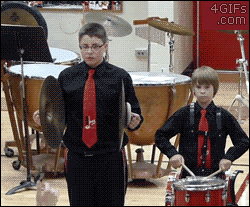 awkward-gif-of-kid-who-drops-cymbal-and-salutes