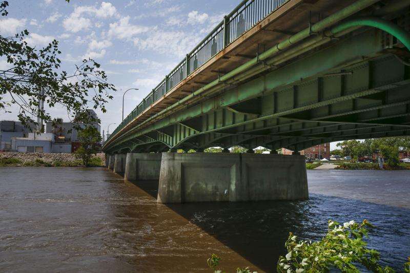 The current Eighth Avenue Bridge is shown June 22, 2016. A proposed new bridge would have a single pier in the water, instead of the current seven piers -- meant to improve the hydraulic flow of the river and reduce upstream backwater water levels. (The Gazette)