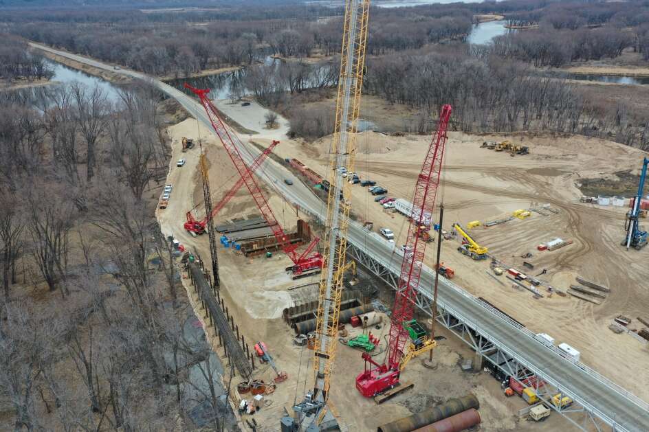 Crews in January work on building a new bridge over the Mississippi River connecting Allamakee County with Crawford County, Wis. Work began on the Wisconsin side of the river. The new bridge will rise just 50 feet to the north of the historic Black Hawk Bridge at Lansing. (Photo from Iowa Department of Transportation)
