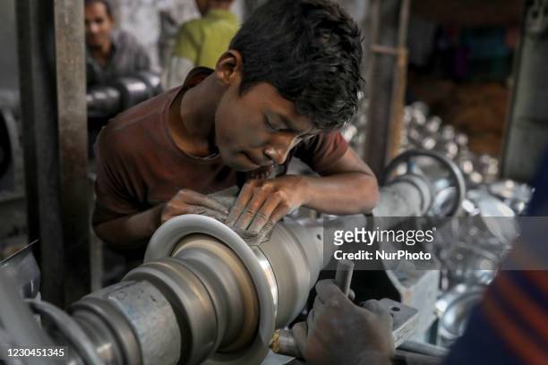rasel-is-10-years-old-who-works-in-an-aluminum-factory-at-dhaka-bangladesh-on-january-06-2021.jpg