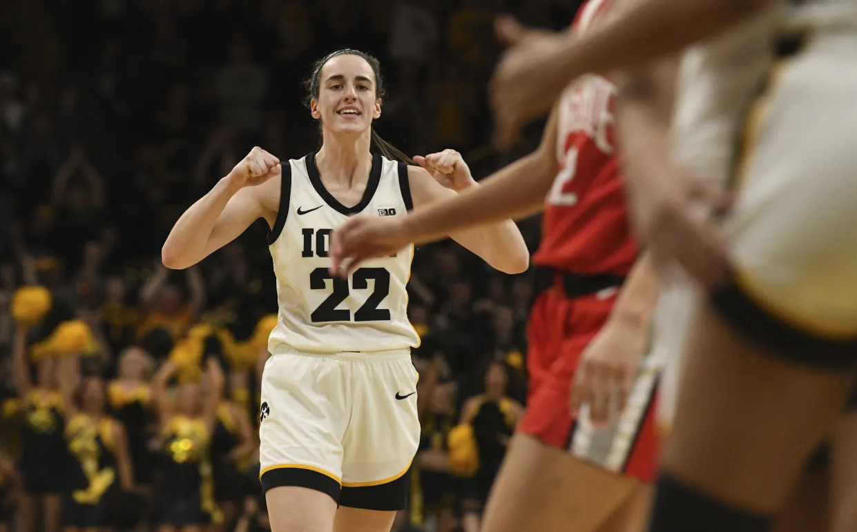 Iowa guard Caitlin Clark (22) celebrates after a foul by Ohio State during the second half of an NCAA college basketball game, Sunday, March 3, 2024, in Iowa City, Iowa. (AP Photo/Cliff Jette)