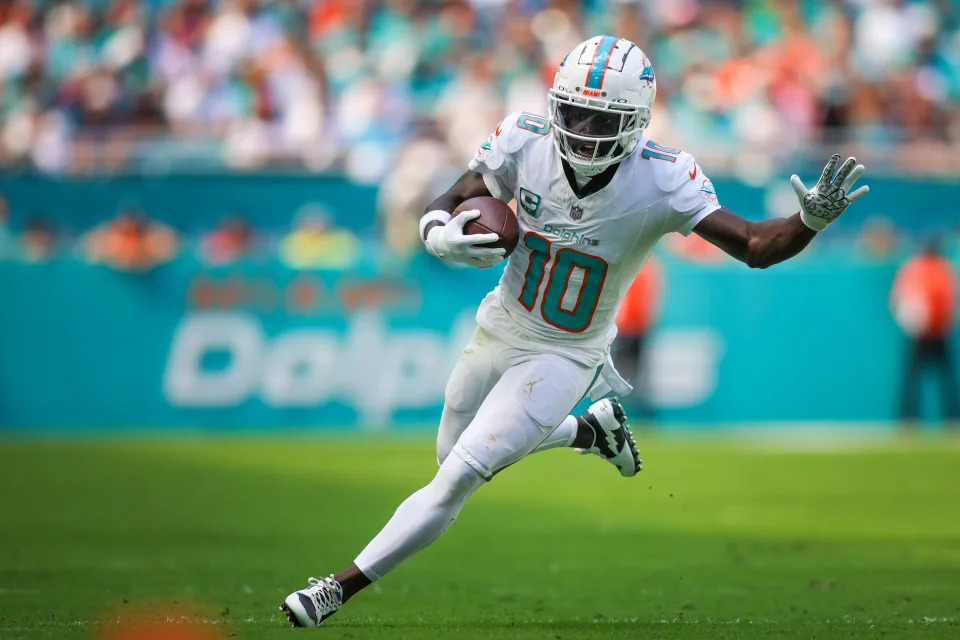 Dolphins wide receiver Tyreek Hill runs with the football against the Panthers during the second quarter at Hard Rock Stadium in Miami Gardens, Fla., on Oct. 15, 2023