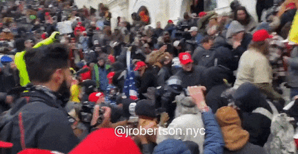 Crowd-Drags-Officer-Down-Steps-as-Capitol-Building-Stormed.gif