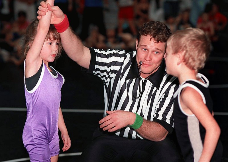 referee-smiles-girl-beats-boy-wrestling.jpg