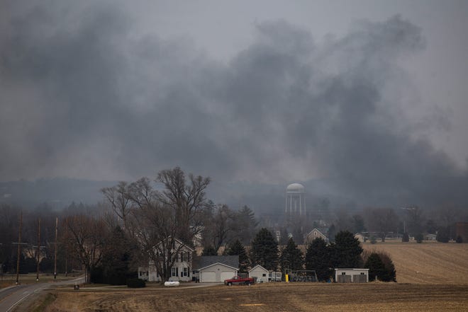 Smoke wafts over the horizon from the fire at G60, a biofuel production plant, Thursday, Dec. 8, 2022, in Marengo, Iowa. 