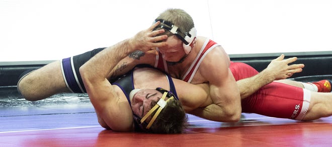 Rutgers' Jackson Turley has Northwestern's Troy Fisher on his back in the first period of the 174-pound bout. Fisher won the bout 11-10. Northwestern won the match 28-6.