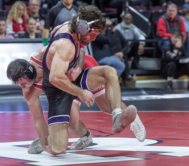 Rutgers' Billy Janzer (back) defeated Northwestern's Andrew Davison 3-1 in Sudden Victory in the 197-pound bout Sunday. Northwestern won the match 28-6.