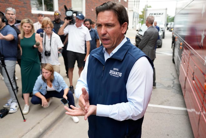 Republican presidential candidate Florida Gov. Ron DeSantis speaks to reporters following a meet and greet at the Hotel Charitone, Thursday, July 27, 2023, in Chariton, Iowa.