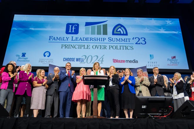 Governor Kim Reynolds signs a 6-week 'fetal heartbeat' abortion ban during the Family Leadership Summit in Des Moines, Friday, July 14, 2023.